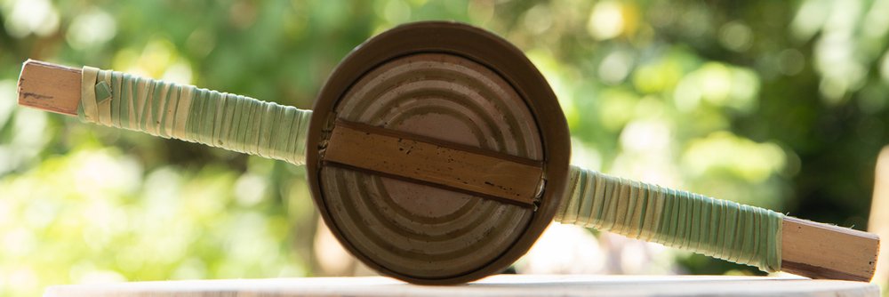 Interior view of the styrofoam puncher showing handles going through the
side holes and across the interior of the can.